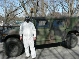 Dave in hazmat suit by HMMWV